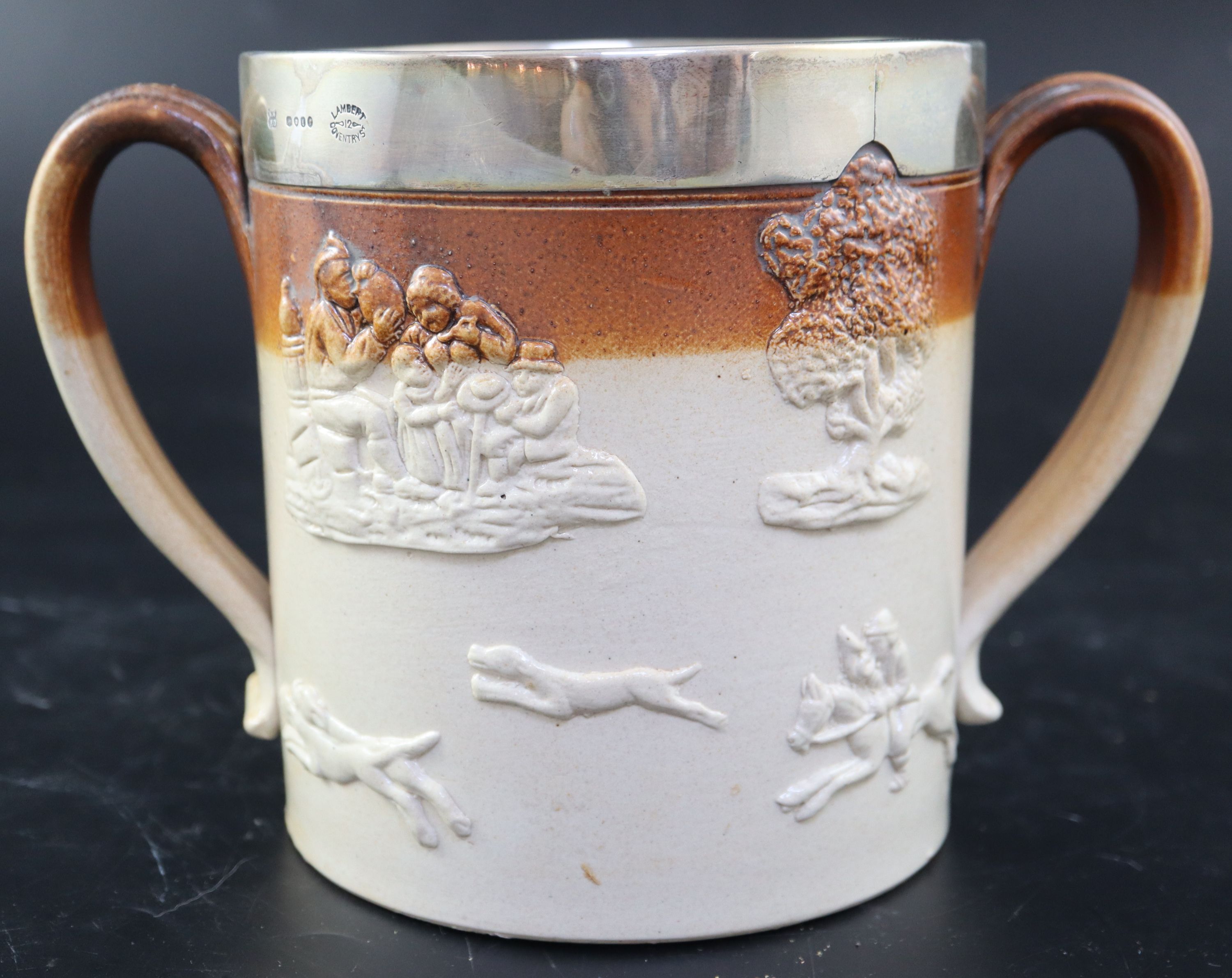 A Victorian silver mounted stoneware loving cup, width 22.5cm height 15cm